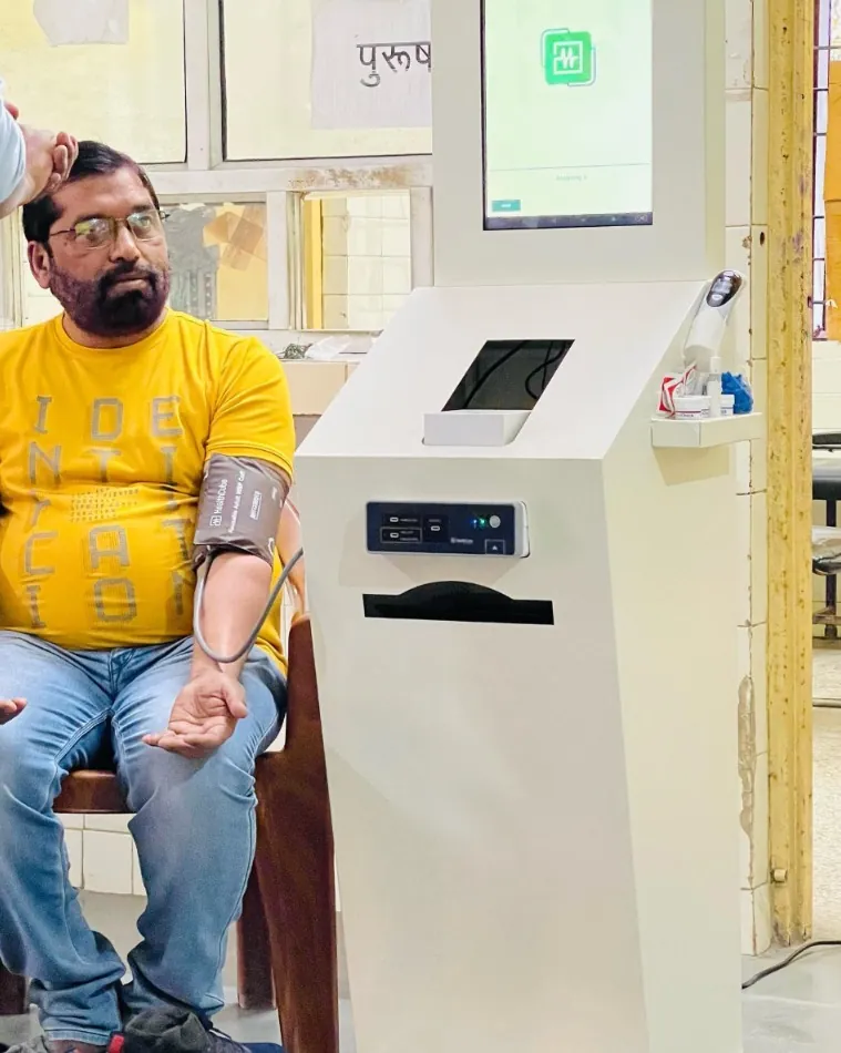 A man having his blood pressure measured at a Health ATM in Gonda